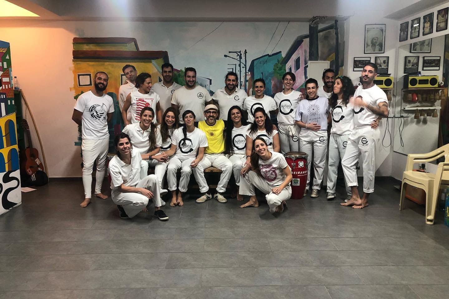 Mestre José Antonio with Apêiara students after a workshop at the academy