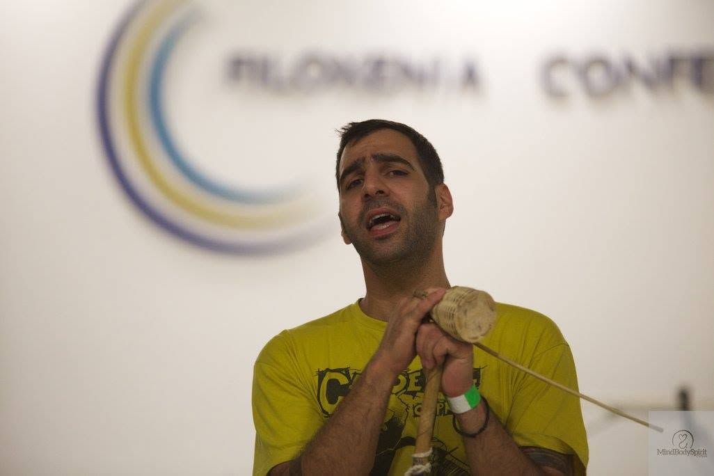 Joseph Pahitas (Amigo) singing and playing the berimbau